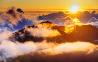 Clouds at sunrise over Haleakala Crater, Maui, Hawaii, USA