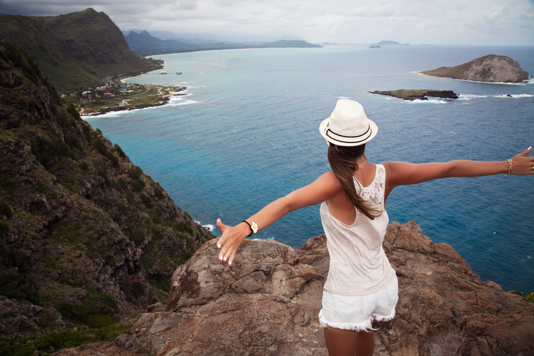 Young girl enjoying a view from top of a mountain in Hawaii